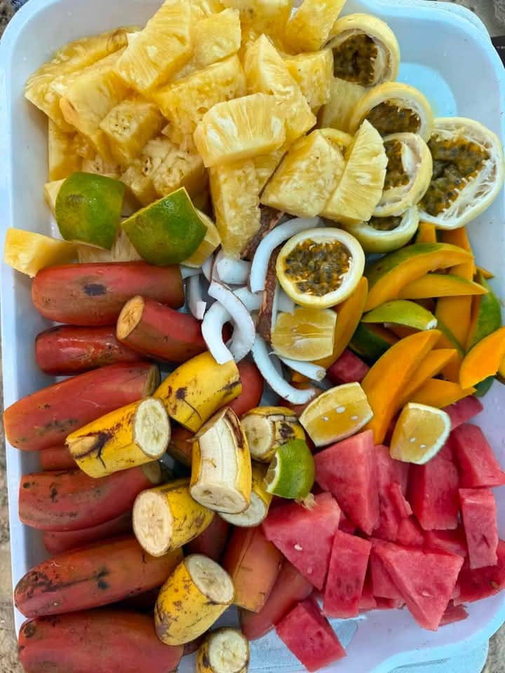 Colourful tropical fruit platter with pineapple, watermelon, passion fruit and bananas
