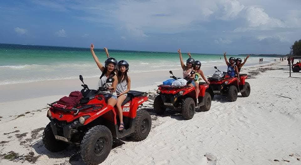 Quad biking on a white sand beach in Zanzibar