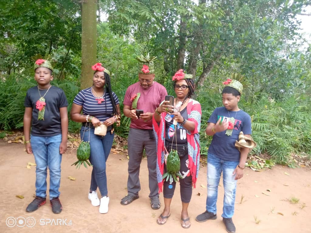 Family enjoying a guided spice tour with handmade flower crowns