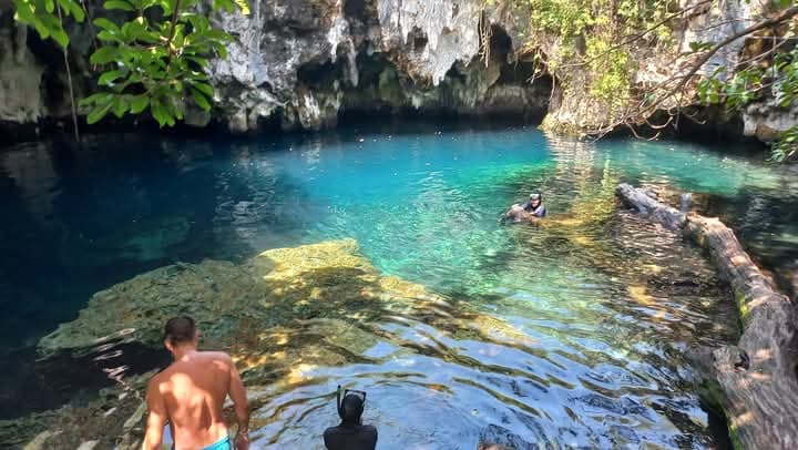 Swimming in a natural cave with crystal clear water